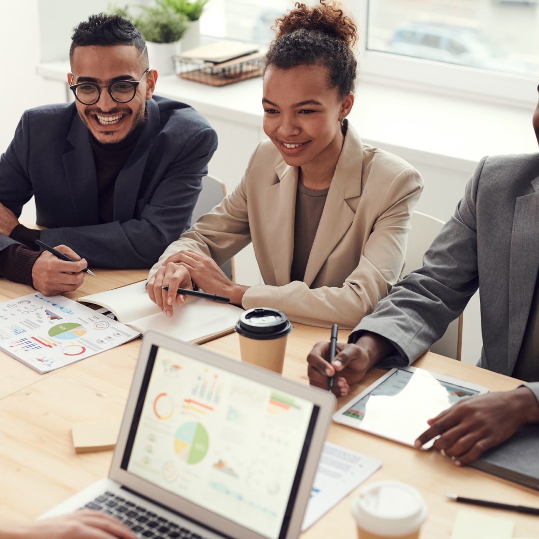 photo-of-three-people-smiling-while-having-a-meeting-3184338-big